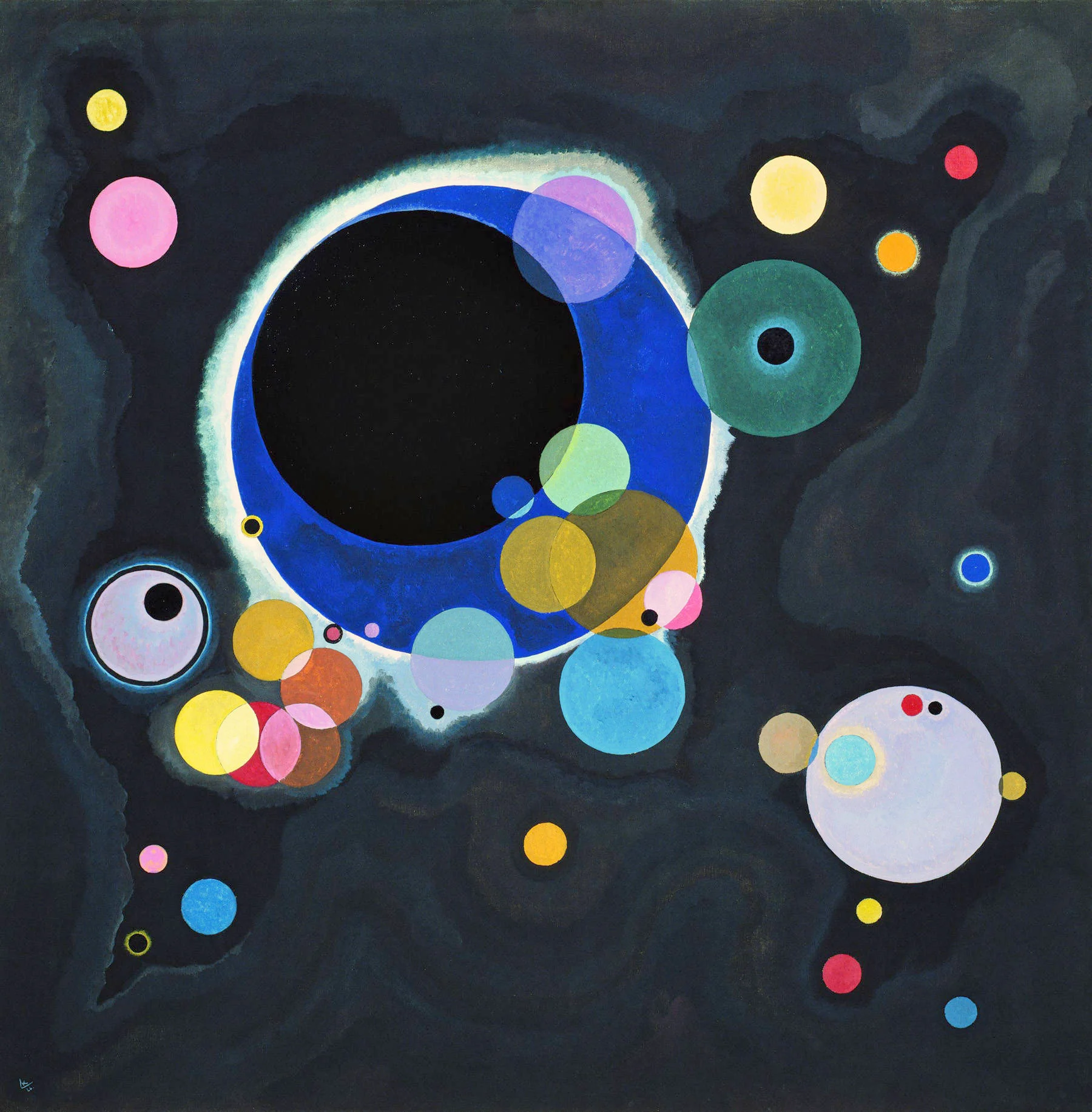 Varios círculos de Wassily Kandinsky, discos luminosos de distintos tamaños suspendidos sobre un fondo oscuro.